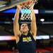 Michigan freshman Mitch McGary dunks the ball during an open practice at the Georgia Dome in Atlanta on Friday, April 5, 2015. Melanie Maxwell I AnnArbor.com